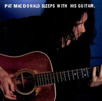 Pat MacDonald sleeps with his guitar